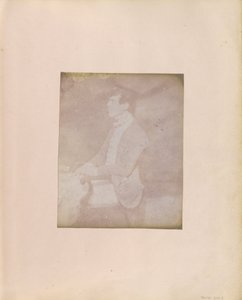 Profile Portrait of a Seated Man in Feathered Cap